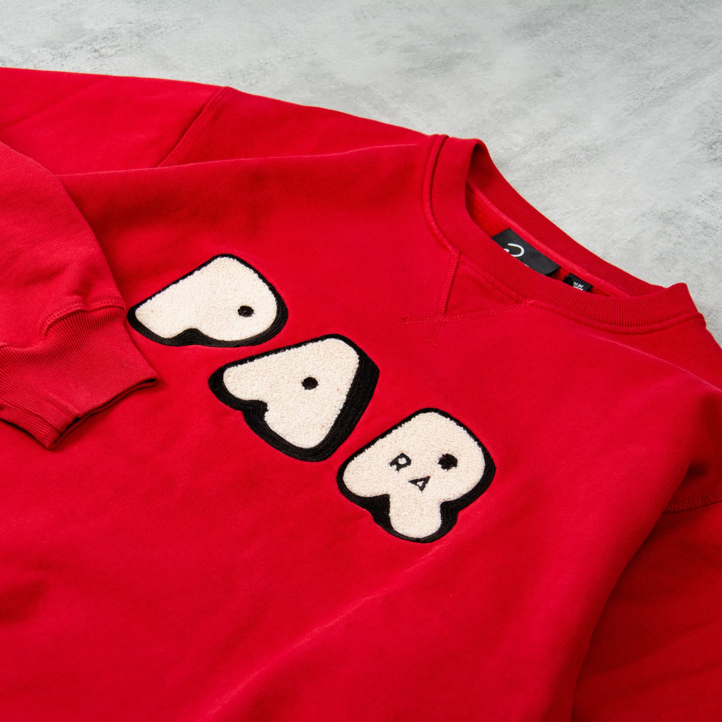 By Parra Rounded PAR Crew Neck Sweat - Ruby Red